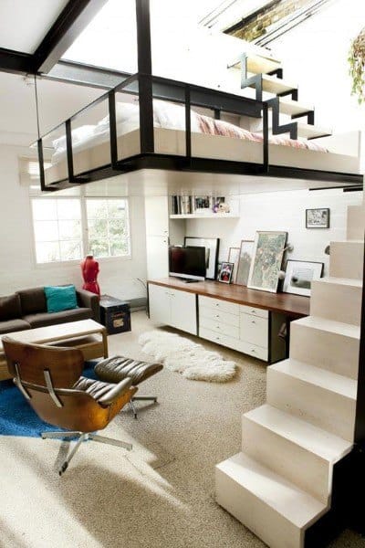 Compact loft with a suspended bedroom, cozy living area, and functional design.