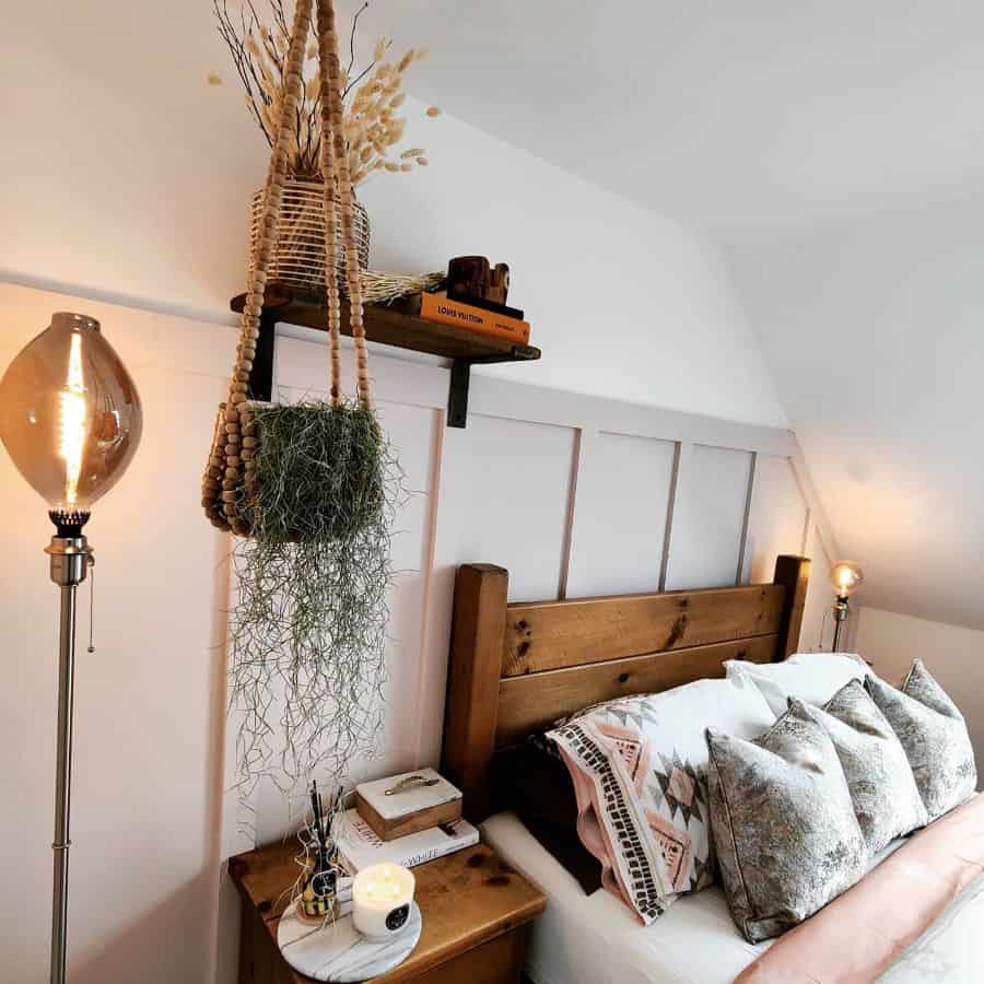 loft bedroom with wood frame bed