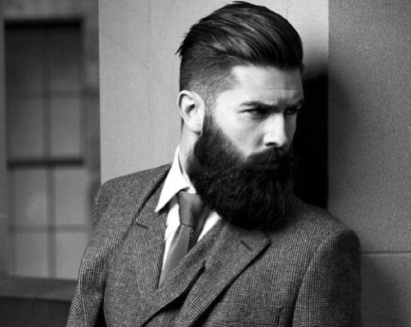 Man with slicked-back undercut and full beard