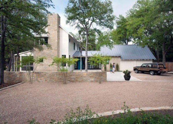 Gravel driveway with a wide, open layout, blending seamlessly into the surrounding natural landscape.