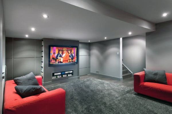 minimalist basement movie room red sofas 