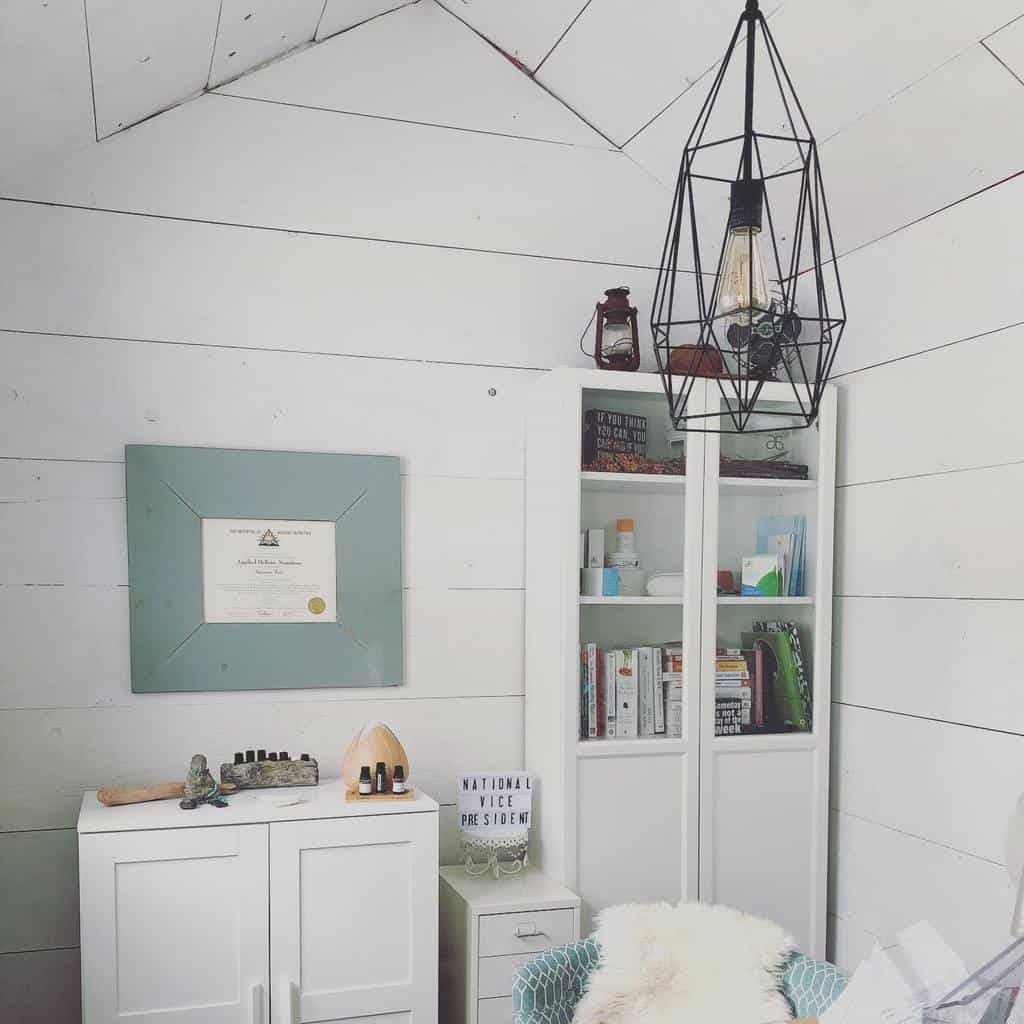 small lounge area in white she shed 