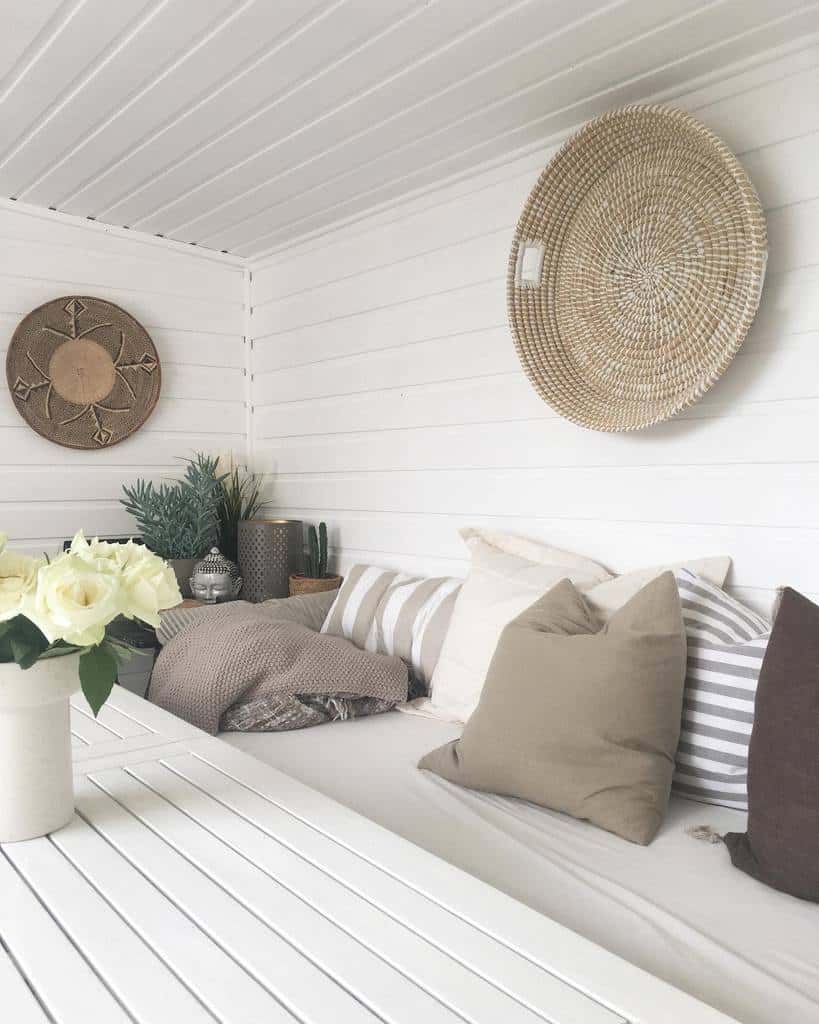 white shiplap she shed with sofa and table 