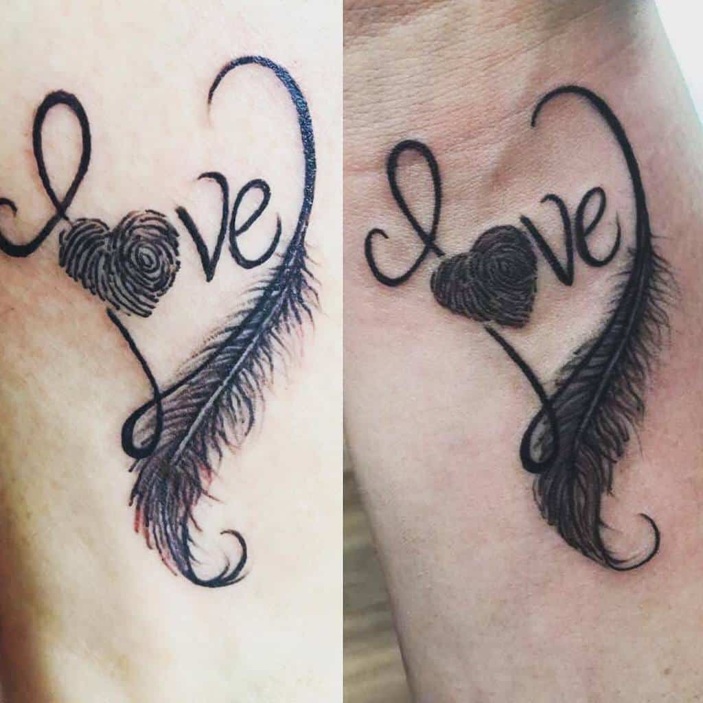 Mother-daughter tattoo of the word "love" with a heart-shaped fingerprint representing the "o" and a feather integrated into the design