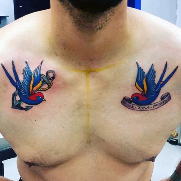 Lovely Pair Of Navy Blue Sparrows Tattoo Guys Chest