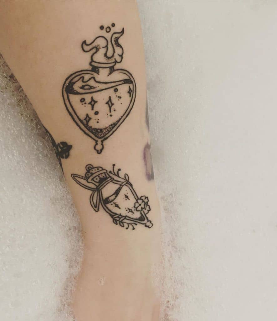 Black ink Harry Potter-inspired tattoos of potion bottles with whimsical details