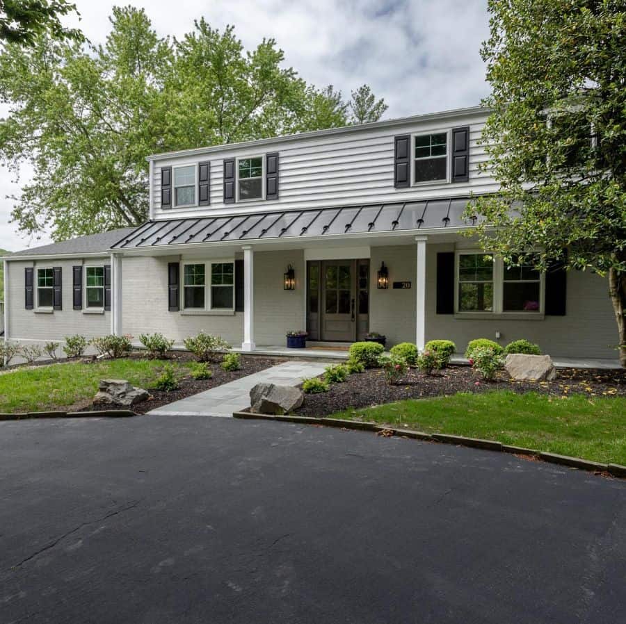 low pitch gable roof modern farmhouse exterior 
