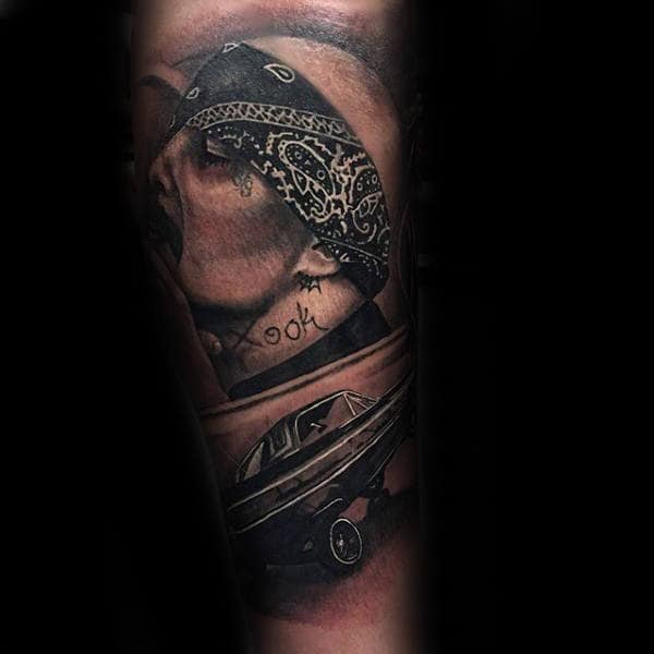 Realistic black and grey 3 dots tattoo featuring a bandana-wearing figure with street-style elements and a detailed lowrider