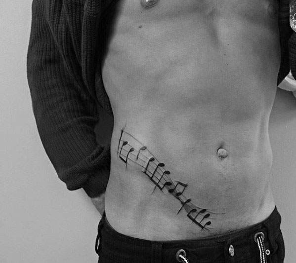 Lower Chest Ribs Music Staff Guys Tattoos