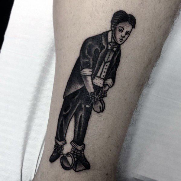 Black and white tattoo of a magician in chains and shackles performing an escape act