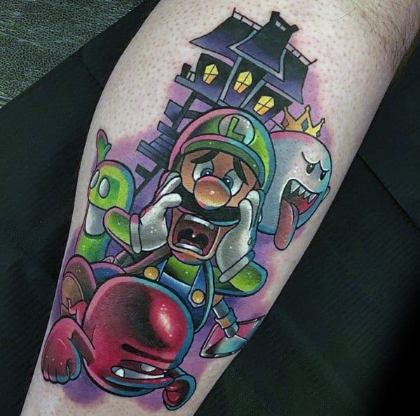 Colorful tattoo of a terrified Luigi running from ghosts, with King Boo, a haunted mansion, and spooky elements in the background.