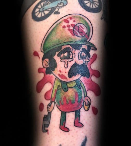 Dark-themed tattoo of a bloodied and crying Luigi, holding a wrench, with a dripping red background, giving a grim and eerie artistic twist.
