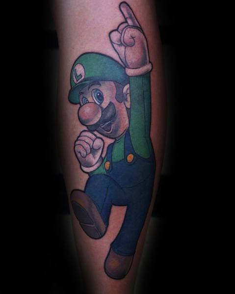 Tattoo of Luigi in a dynamic pose, mid-jump with one finger pointing up, featuring detailed shading and vibrant colors on the leg.
