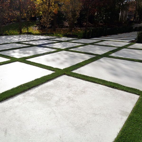 concrete paver driveway with grass joints