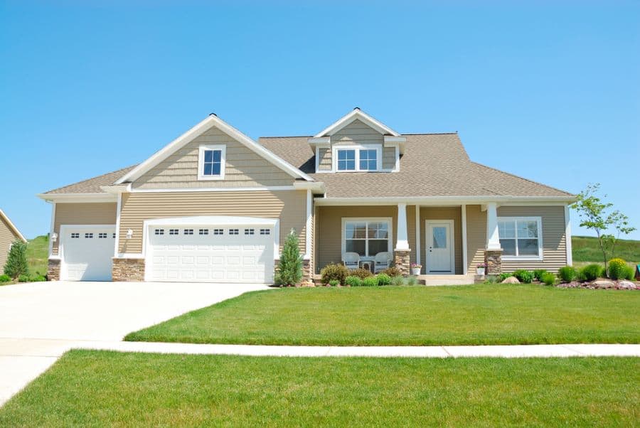 large grass lawn ranch-style house