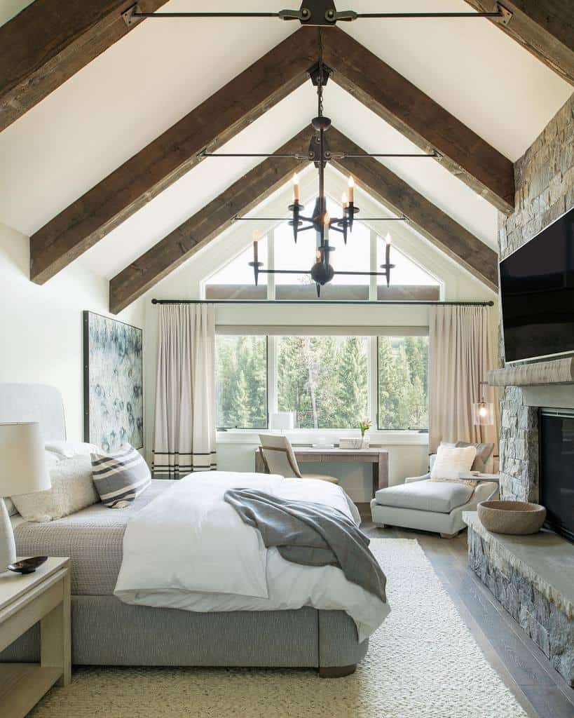 luxury cabin style bedroom with vaulted ceiling