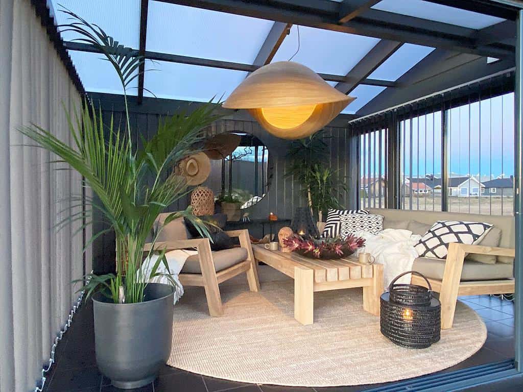 luxurious she shed with skylight roof and wood outdoor setting 