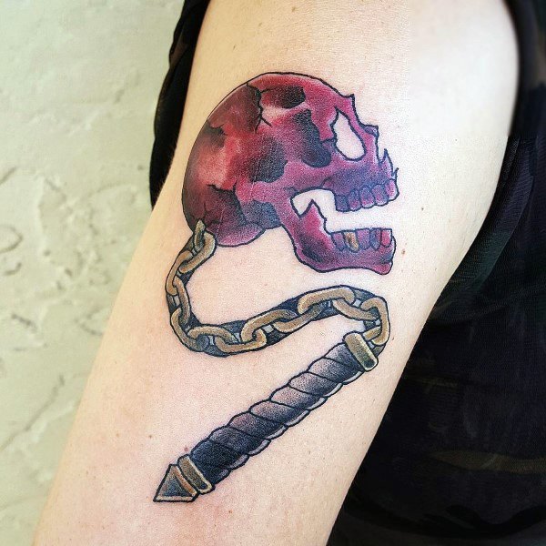 Unique mace tattoo featuring a spiked skull in red hues, connected to a chain and handle, symbolizing mortality, strength, and battle.