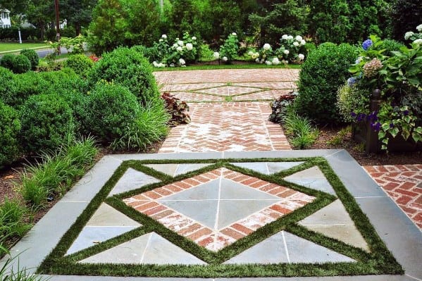 Geometric brick and grass design in a landscaped garden walkway