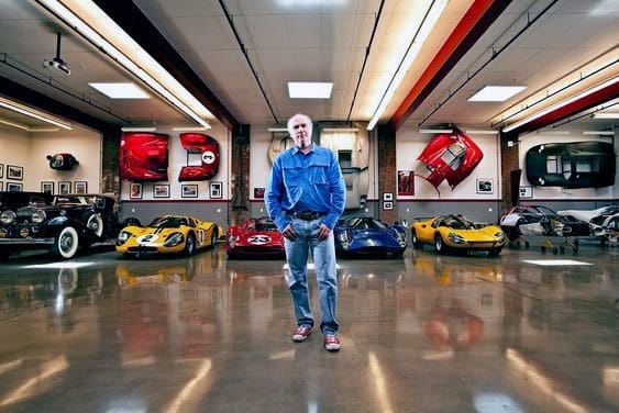 large modern garage polished cement floor car parts on walls