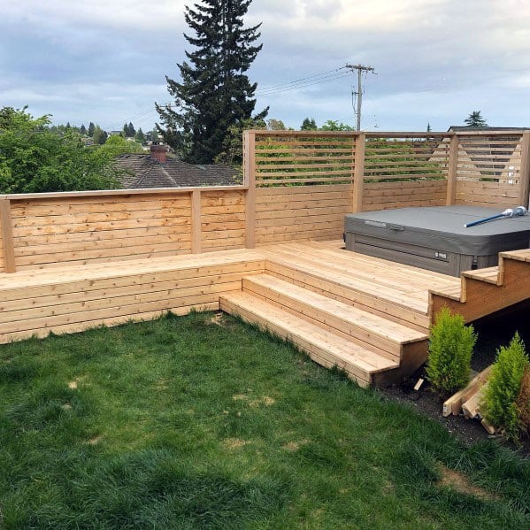 wood deck with privacy fence hot tub