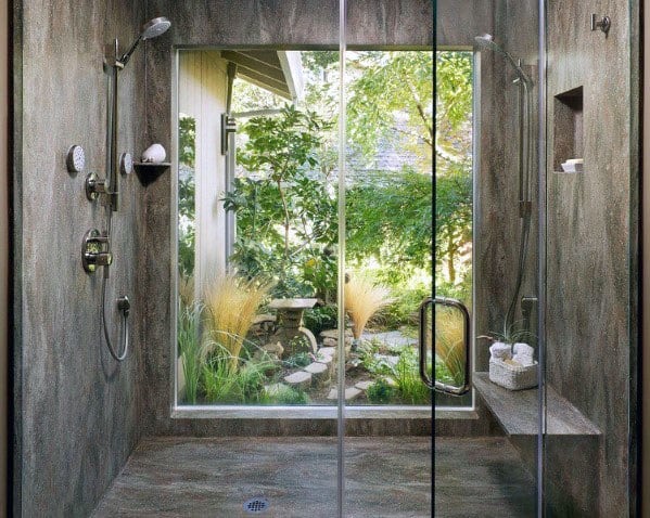 huge walk-in shower dual shower heads bench window garden view