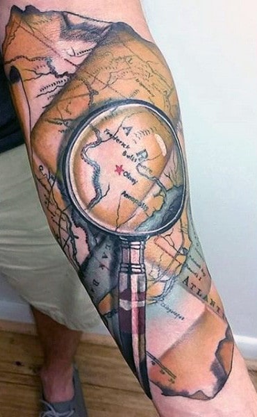 Magnifying Glass World Map Male Tattoo On Forearm