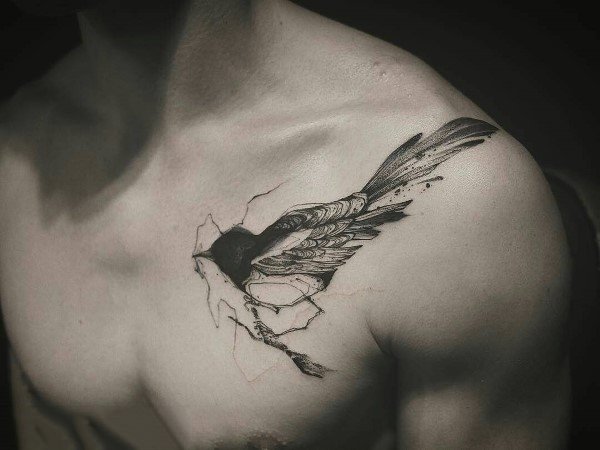 Black and gray magpie tattoo on the chest, designed with a cracked effect, symbolizing freedom and breaking through barriers with intricate shading.