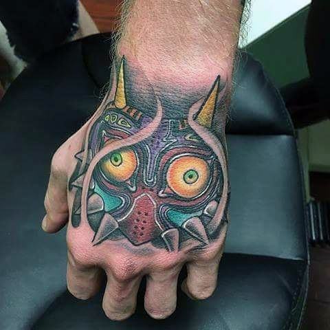 Majoras Mask Tattoo Ideas For Gentlemen On Hand