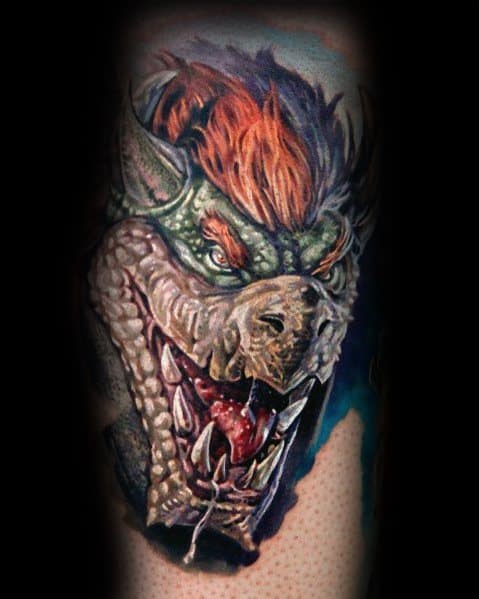 Realistic Bowser tattoo on a man's arm featuring intense details, fierce expression, sharp fangs, and dramatic shading for a powerful design.