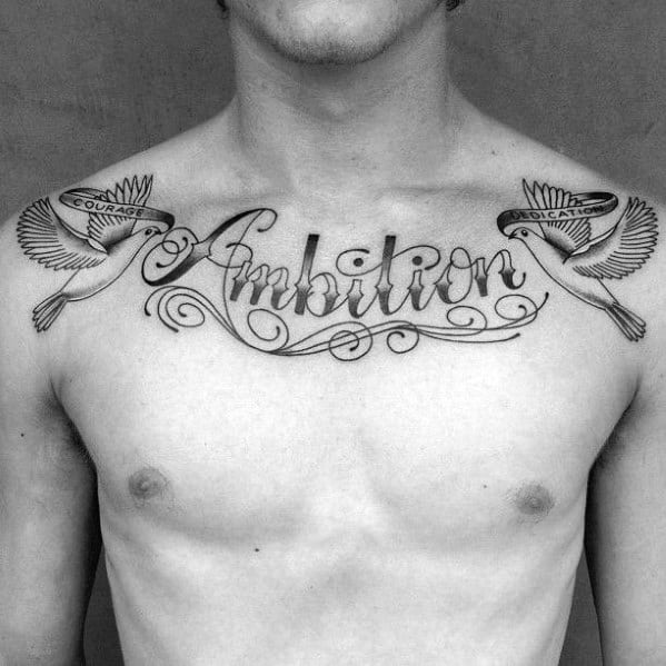 Man's chest tattoo with "Ambition," featuring birds holding banners of "Courage" and "Dedication"