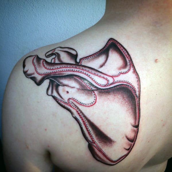 Tattoo of a shoulder blade bone (scapula) on the upper back, outlined in black and red with smooth shading for dimension.
