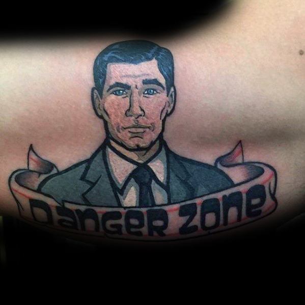 Classic Archer tattoo featuring the spy in a suit with a bold 'Danger Zone' banner, done in a clean, comic-style design.