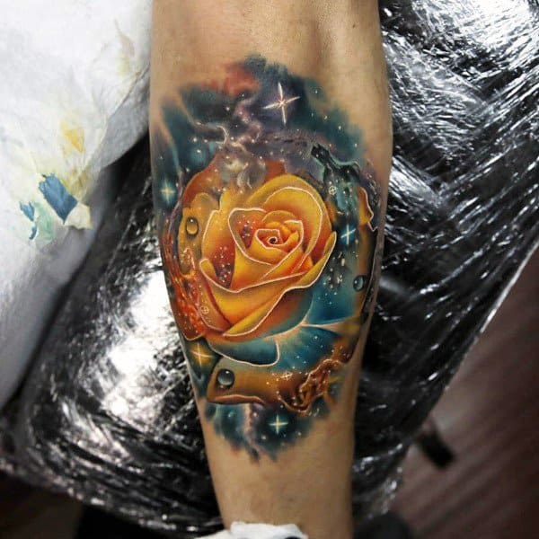 Tattoo of a vibrant yellow rose with water droplets and abstract colorful background