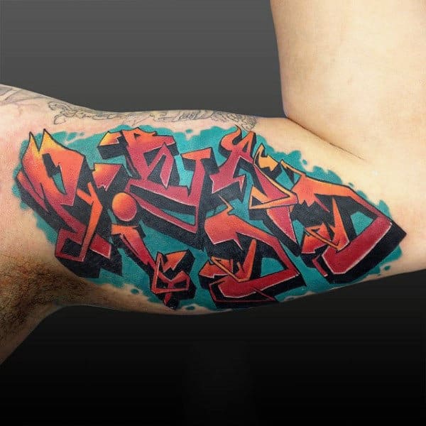 Male Bicep Graffiti Orange Symbol Tattoo