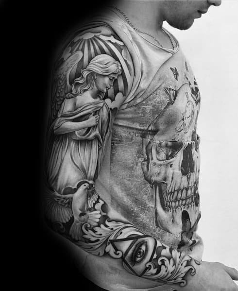 Black and grey full-sleeve tattoo featuring a detailed angel, a large cracked skull, an all-seeing eye, and intricate shading for a spiritual and gothic design.