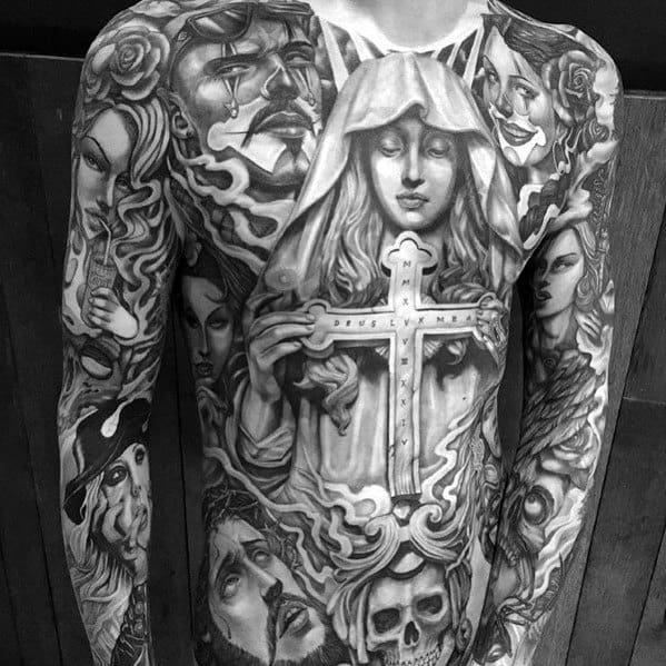 Black and grey full-torso and sleeve tattoo featuring a veiled woman holding a cross, surrounded by expressive faces, skulls, and intricate shading for a dramatic design.