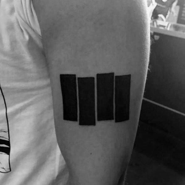 Bold and clean Black Flag bars tattooed on the upper forearm, standing tall as a minimalist tribute to punk rebellion.