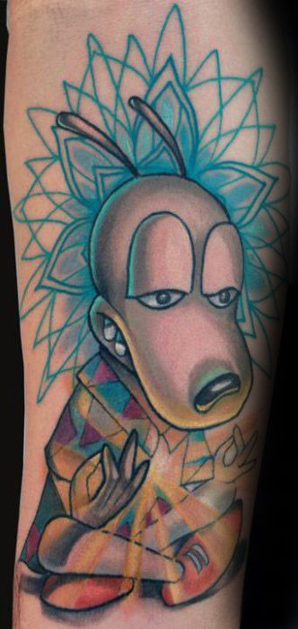 Colorful tattoo of Rocko from Rocko’s Modern Life in a meditative pose, with a radiant geometric aura behind him and a peaceful expression.