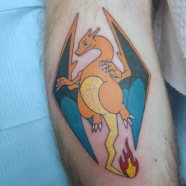 Minimalist Charizard tattoo with sharp lines, teal wings, and a lightning bolt tail ending in a flame, framed in a diamond shape.