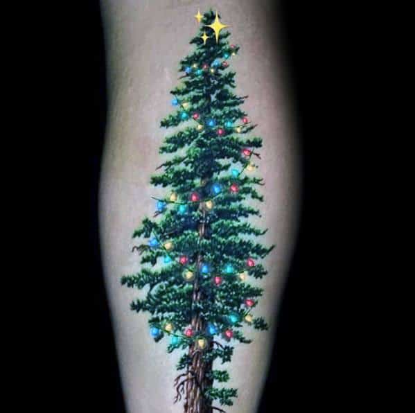 Realistic Christmas tree tattoo with intricate branches, colorful string lights, and a glowing star on top, creating a festive and natural design.