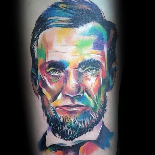 Colorful abstract tattoo of a bearded man reminiscent of Abraham Lincoln