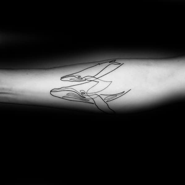 Minimalist continuous line tattoo of two whales on the forearm, featuring sleek black ink strokes for a graceful and artistic ocean-inspired design.