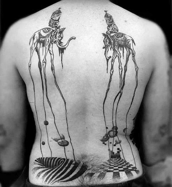 Large black and grey back tattoo of two surreal Dali-style elephants with elongated legs walking over a dreamlike landscape of floating shapes and patterns.