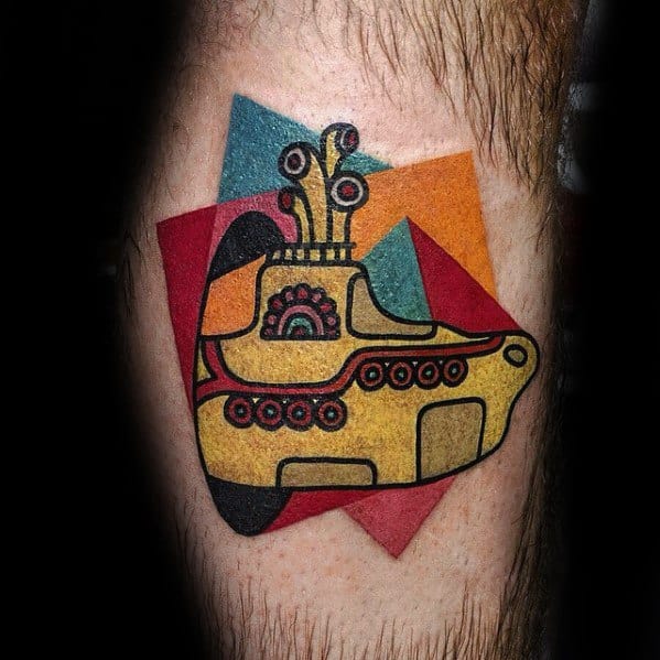Bold and colorful tattoo of The Beatles’ Yellow Submarine with a retro geometric background of overlapping red, blue, orange, and teal shapes.