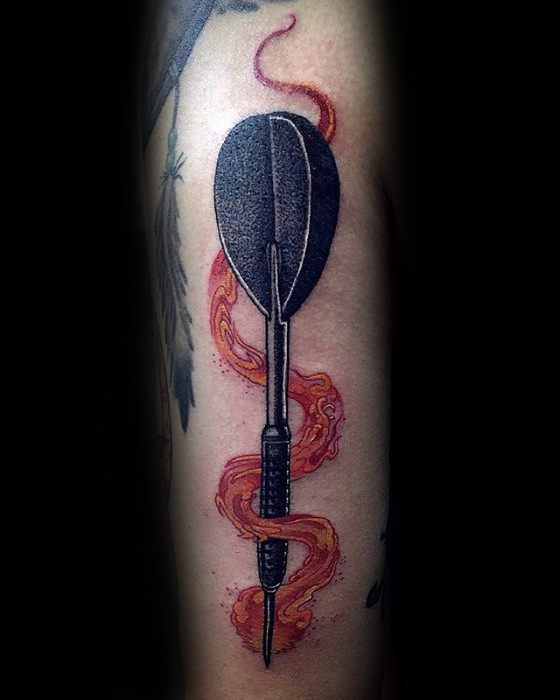 Striking dart tattoo with bold black detailing, wrapped in flowing red-orange flames, symbolizing fiery passion and precision.