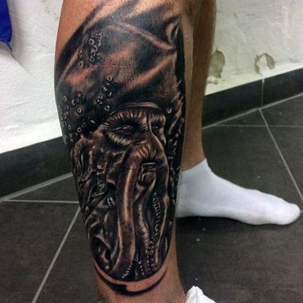 Tattoo of a detailed octopus, reminiscent of Davy Jones, on a calf with a white sock