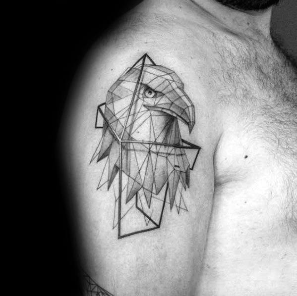 Geometric eagle tattoo on the upper arm with fine linework and angular patterns, blending realism and abstract shapes for a sharp modern design.