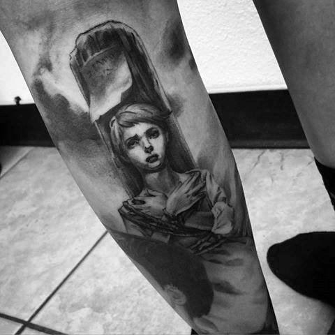 Black and grey realism tattoo of Joan of Arc tied to a stake, capturing a dramatic and emotional moment before her execution.