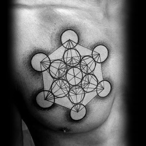Bold chest tattoo of Metatron’s Cube with thick-lined circles and shaded background, centered over the pectoral for a powerful geometric look.